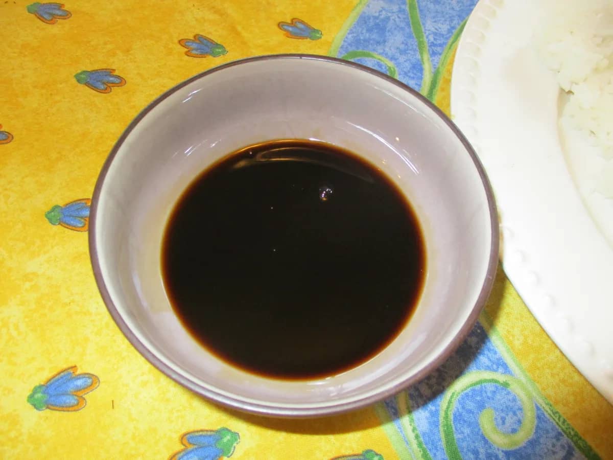 Dark soy sauce in a small ceramic bowl