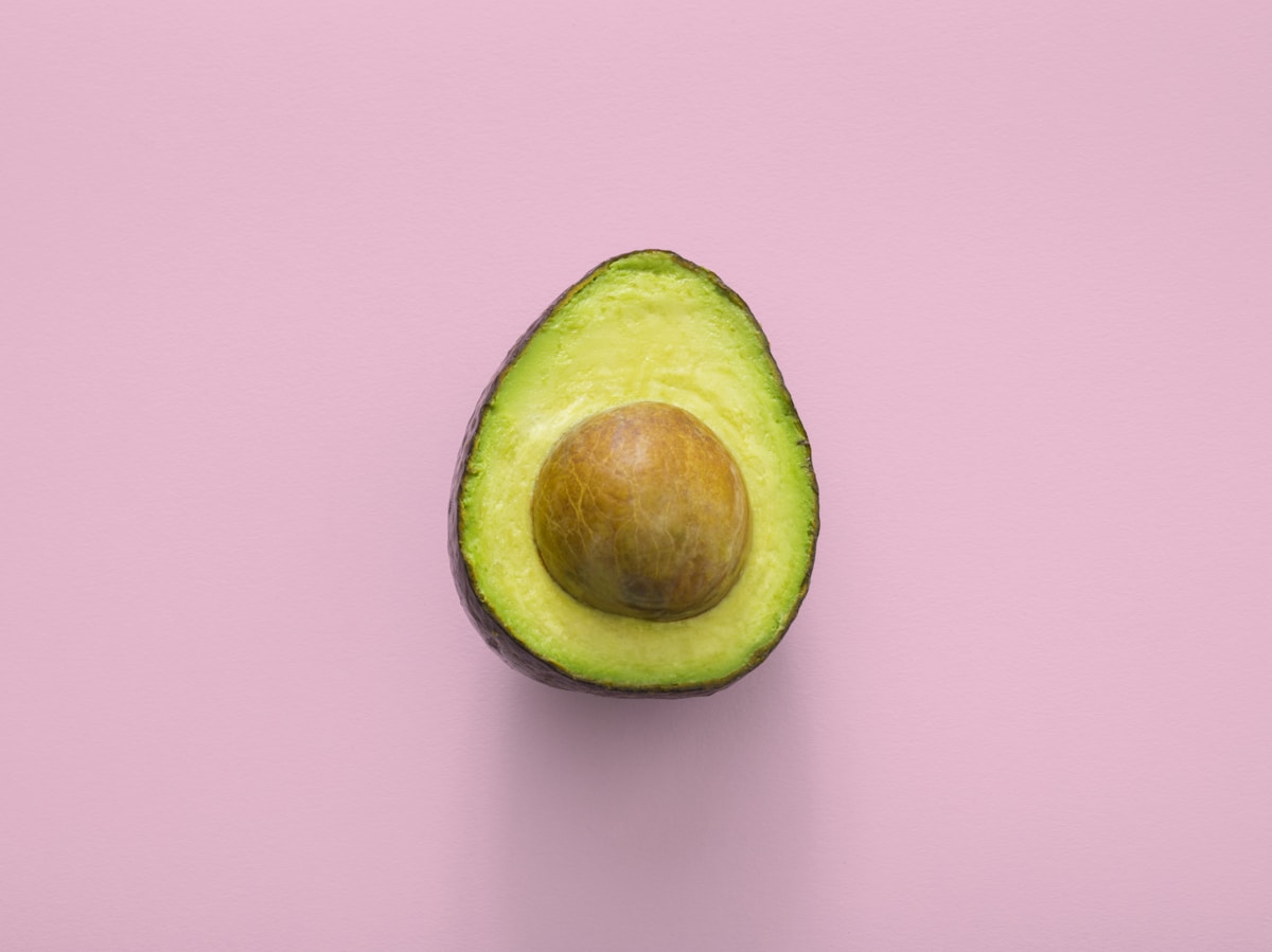 Perfectly ripe avocado halves showing seed