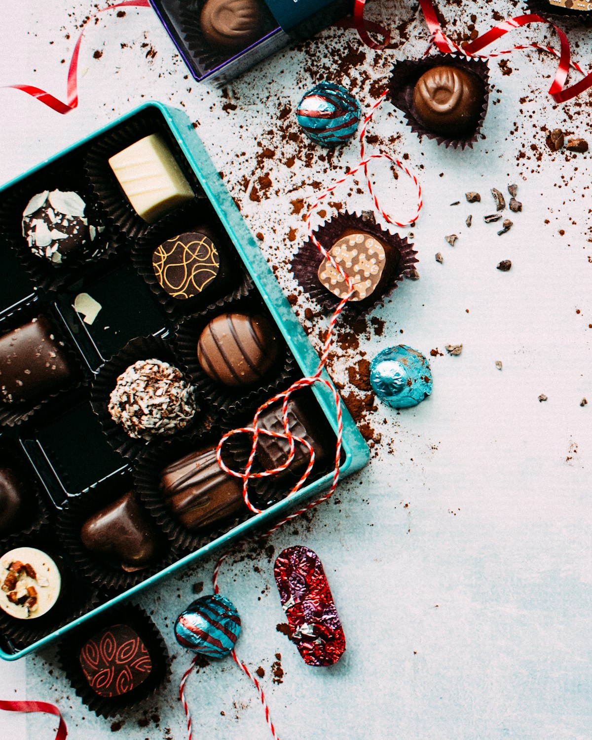 Dark chocolate pieces with cocoa powder and cacao nibs