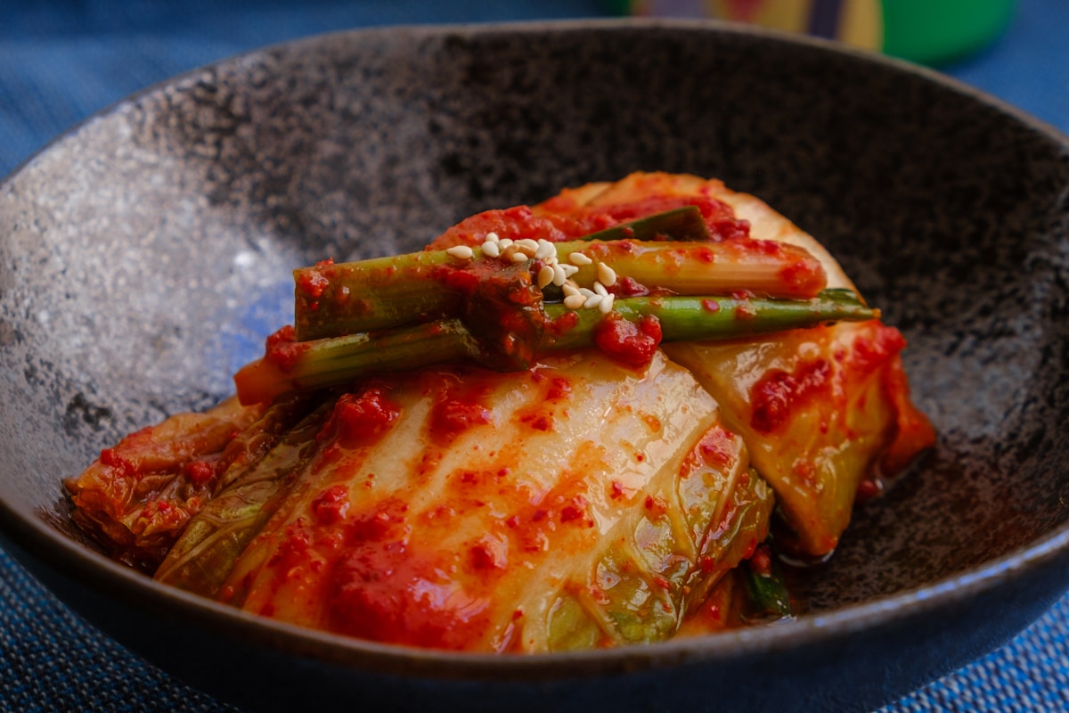 Traditional napa cabbage kimchi in a ceramic bowl