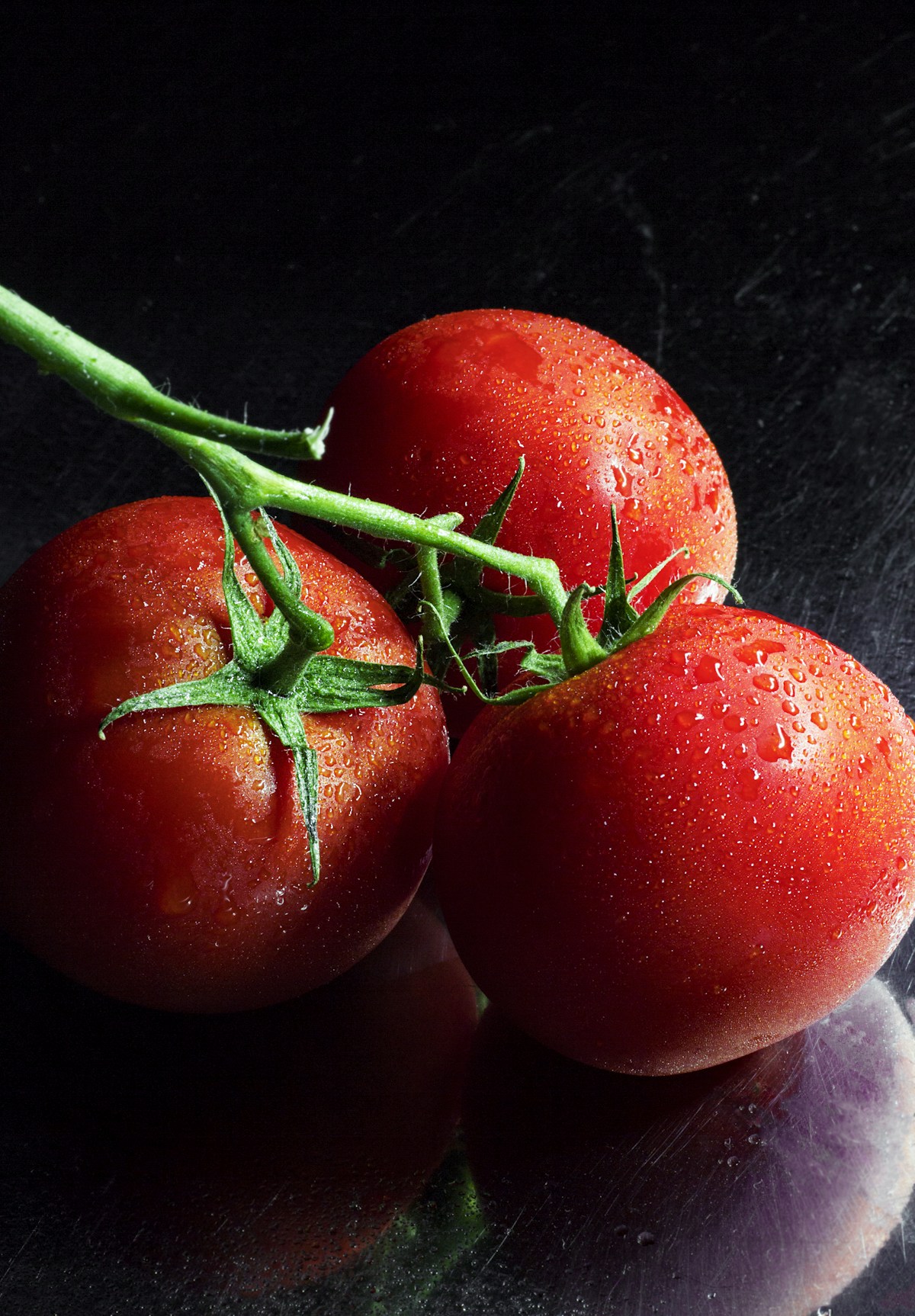 Vine-ripened heirloom tomatoes in warm sunlight