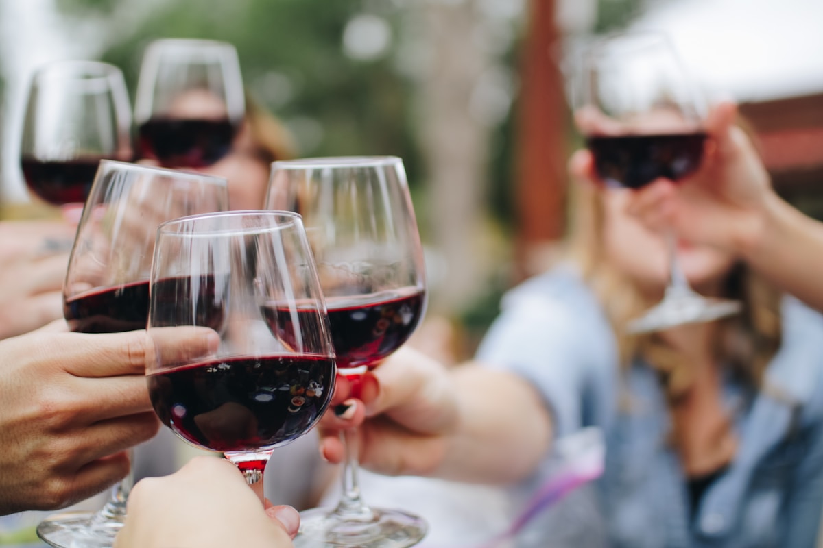 Red wine being poured into a crystal glass