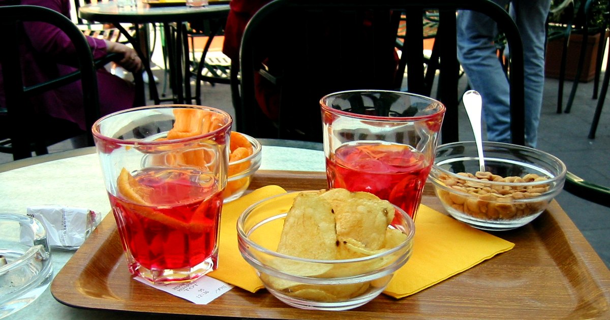 Kitchen-table photograph showing campari and accompanying tools