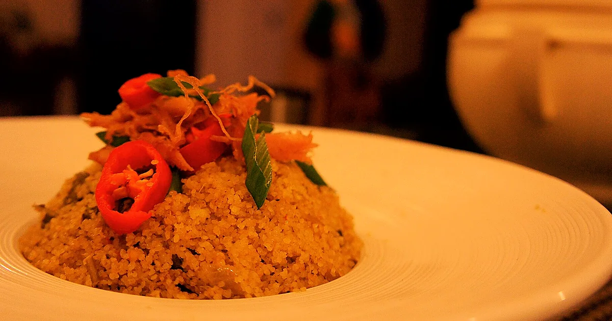 Pale fonio grains beside West African fields, porridge, and steamed fonio