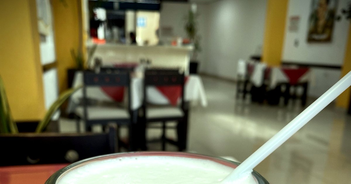 Kitchen-table photograph showing horchata and accompanying tools