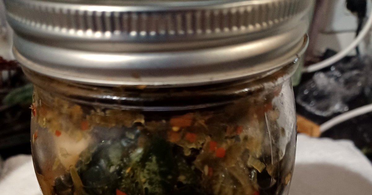 Kitchen-table photograph showing kimchi and accompanying tools