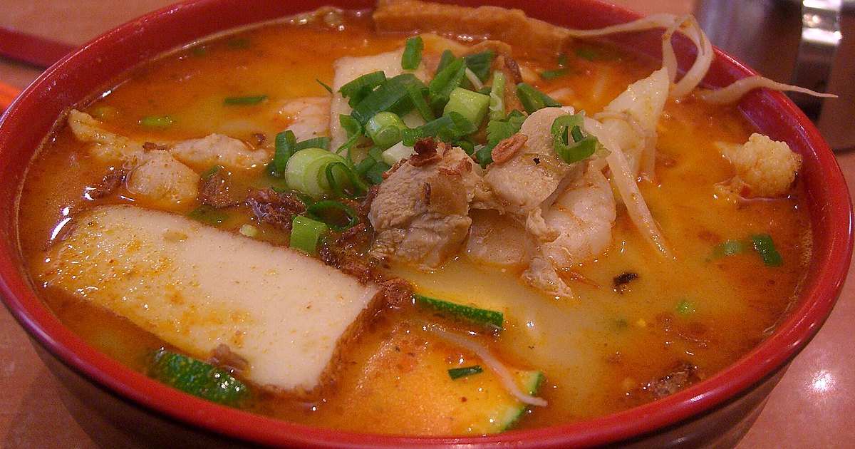 Editorial still life of laksa with related pantry items