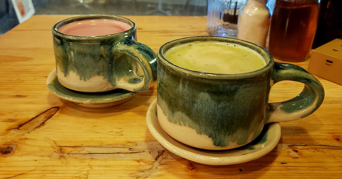 Kitchen-table photograph showing matcha and accompanying tools
