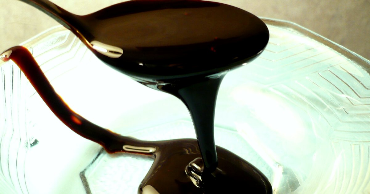 Kitchen-table photograph showing molasses and accompanying tools