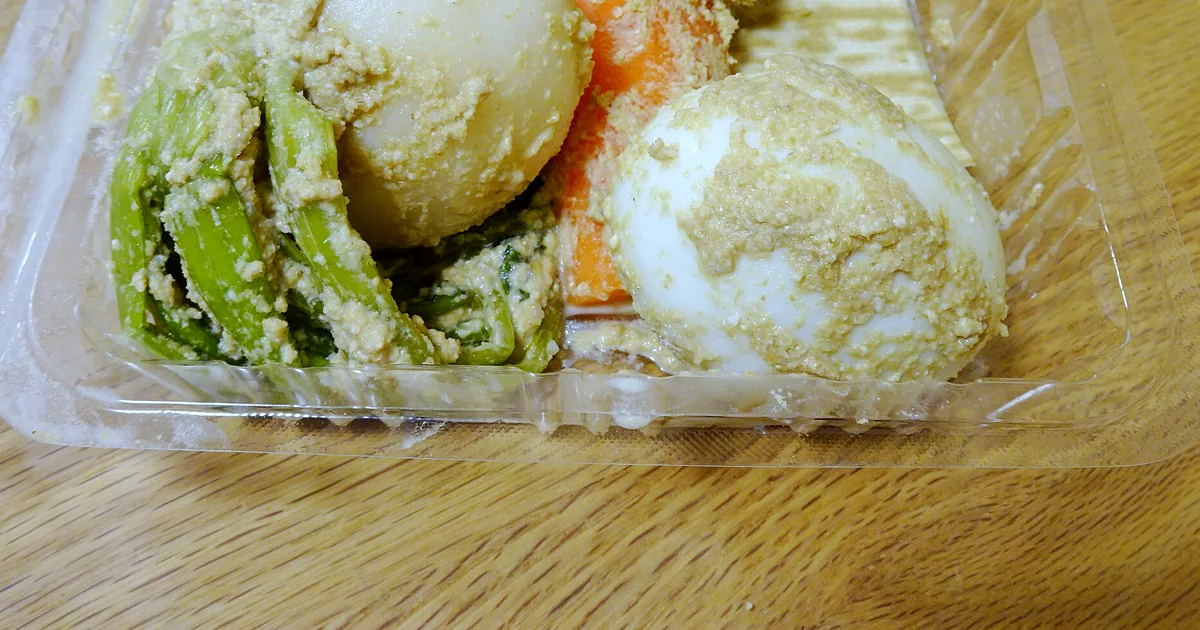 Japanese nukazuke vegetables emerging from a brown rice bran fermentation bed