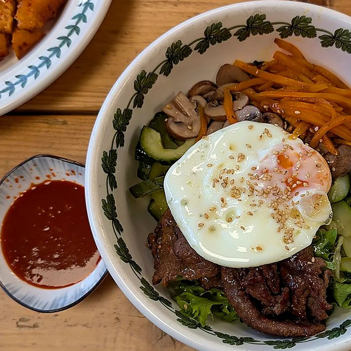 Crisp rice and assembly for Bibimbap, showing the ingredients and preparation at this stage