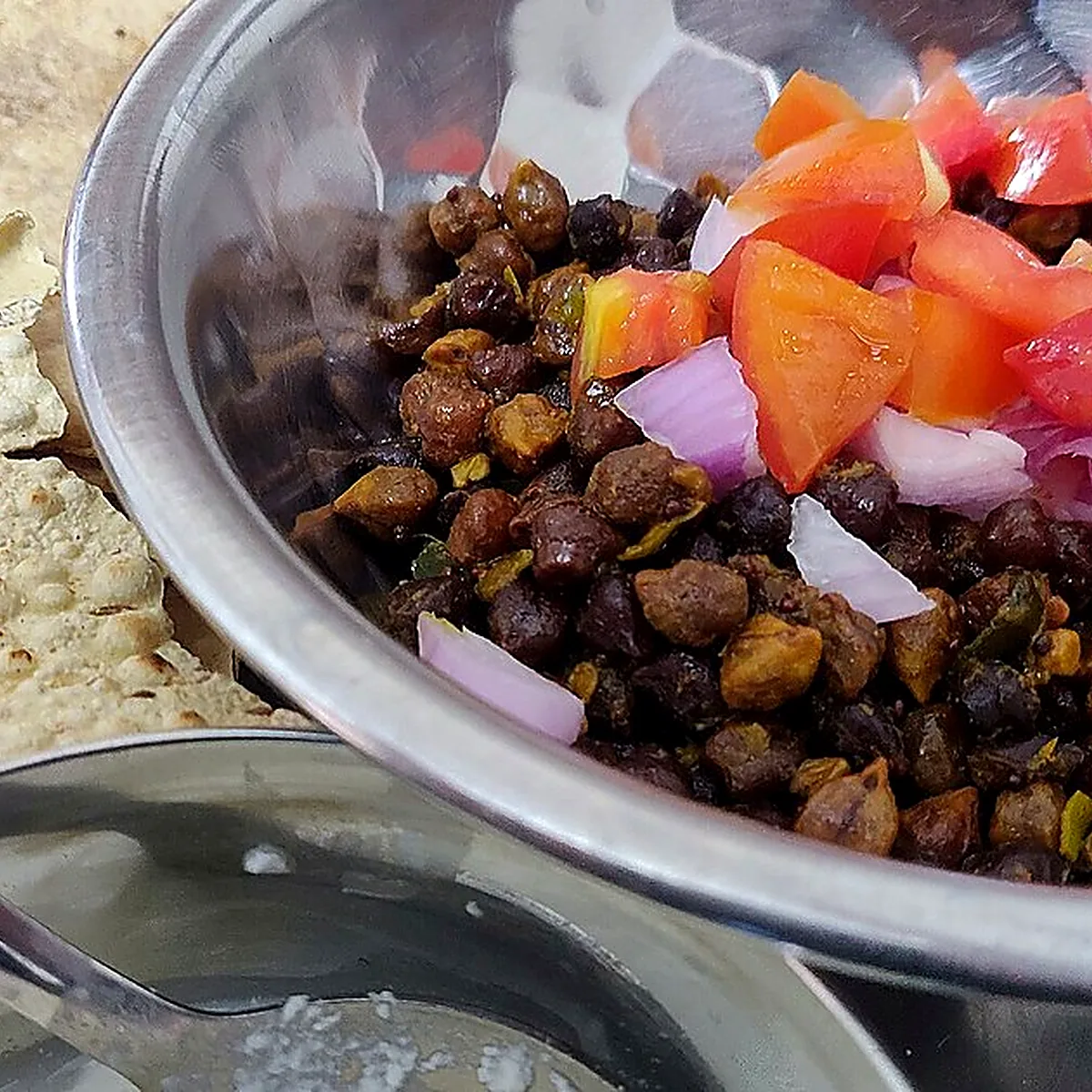 Step 1 for Chana Masala, showing the ingredients and preparation at this stage
