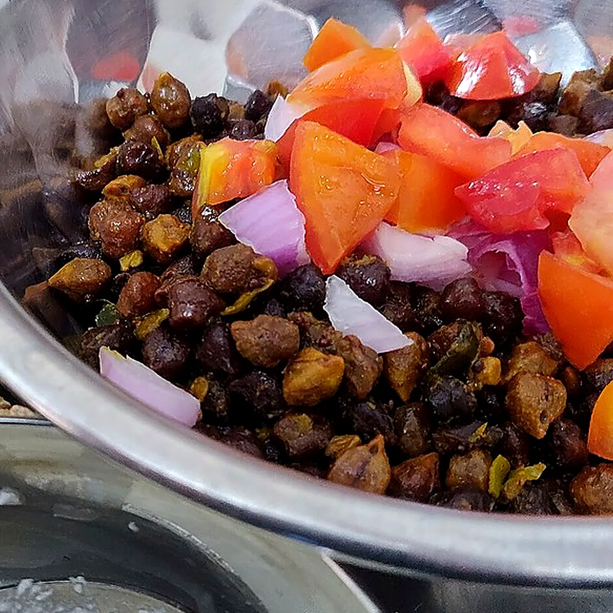 Step 3 for Chana Masala, showing the ingredients and preparation at this stage