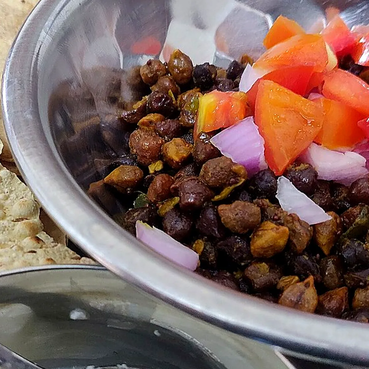 Step 4 for Chana Masala, showing the ingredients and preparation at this stage