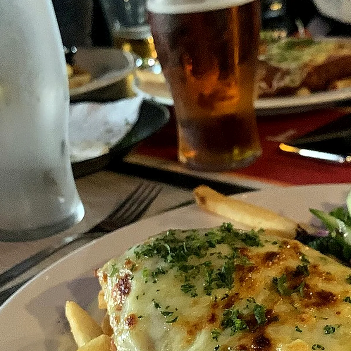 Chicken and assembly for Chicken Parmesan, showing the ingredients and preparation at this stage