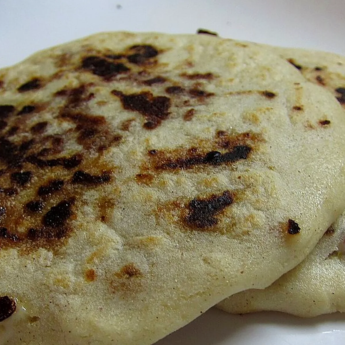 Step 4 for Pupusas, showing the ingredients and preparation at this stage
