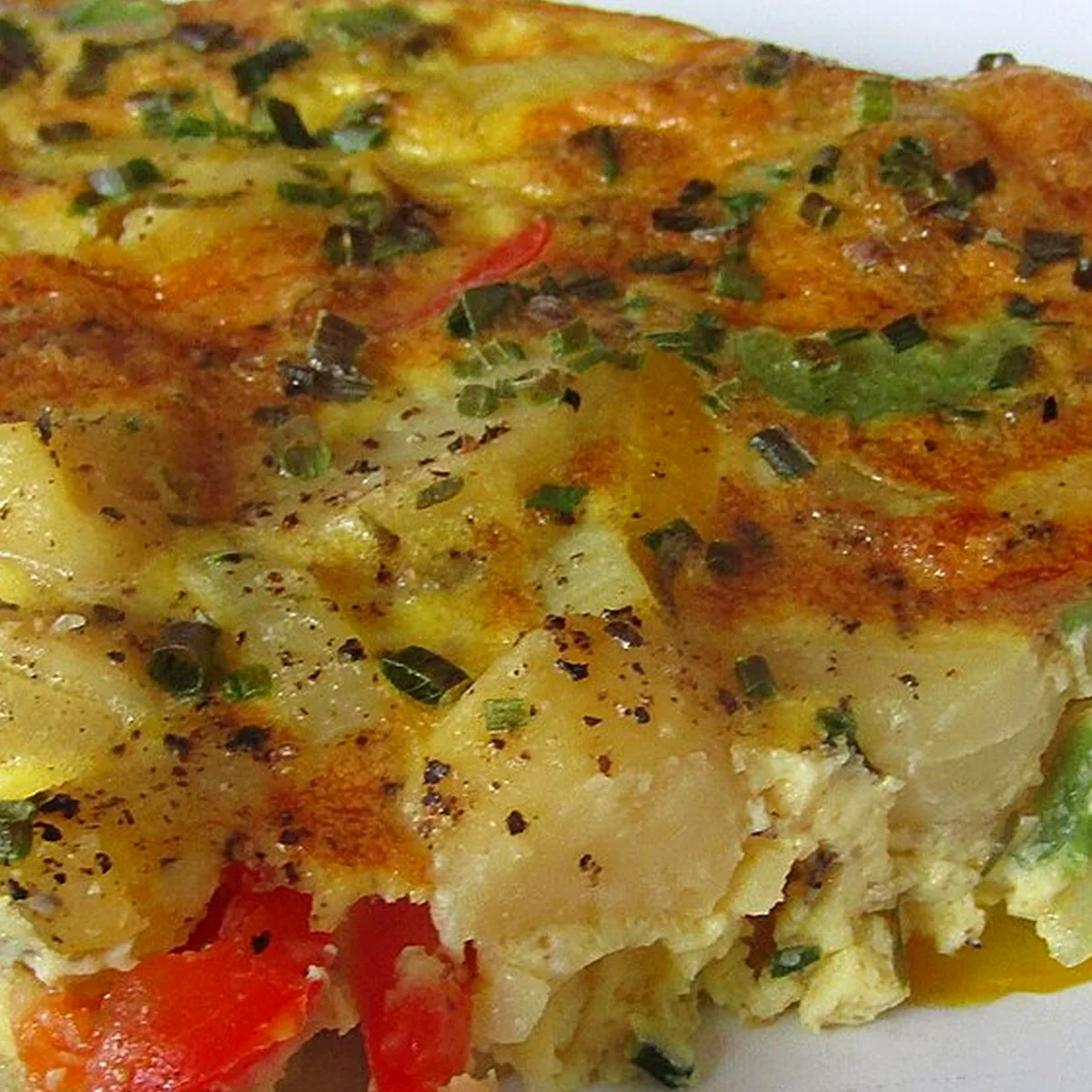 Step 4 for Tortilla Española, showing the ingredients and preparation at this stage