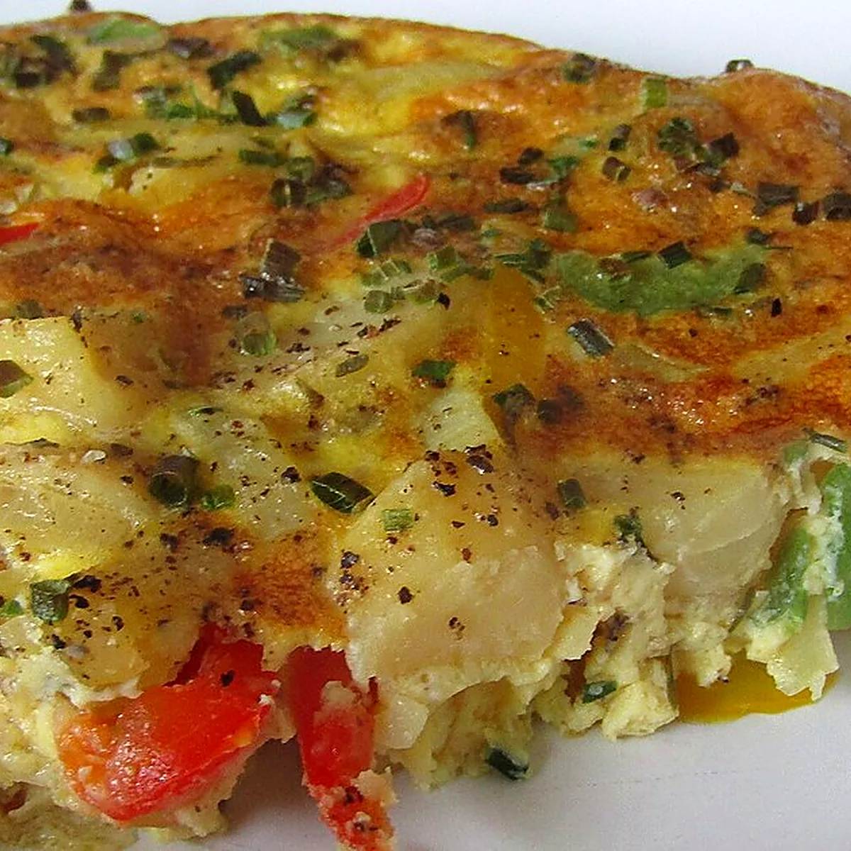 Step 5 for Tortilla Española, showing the ingredients and preparation at this stage