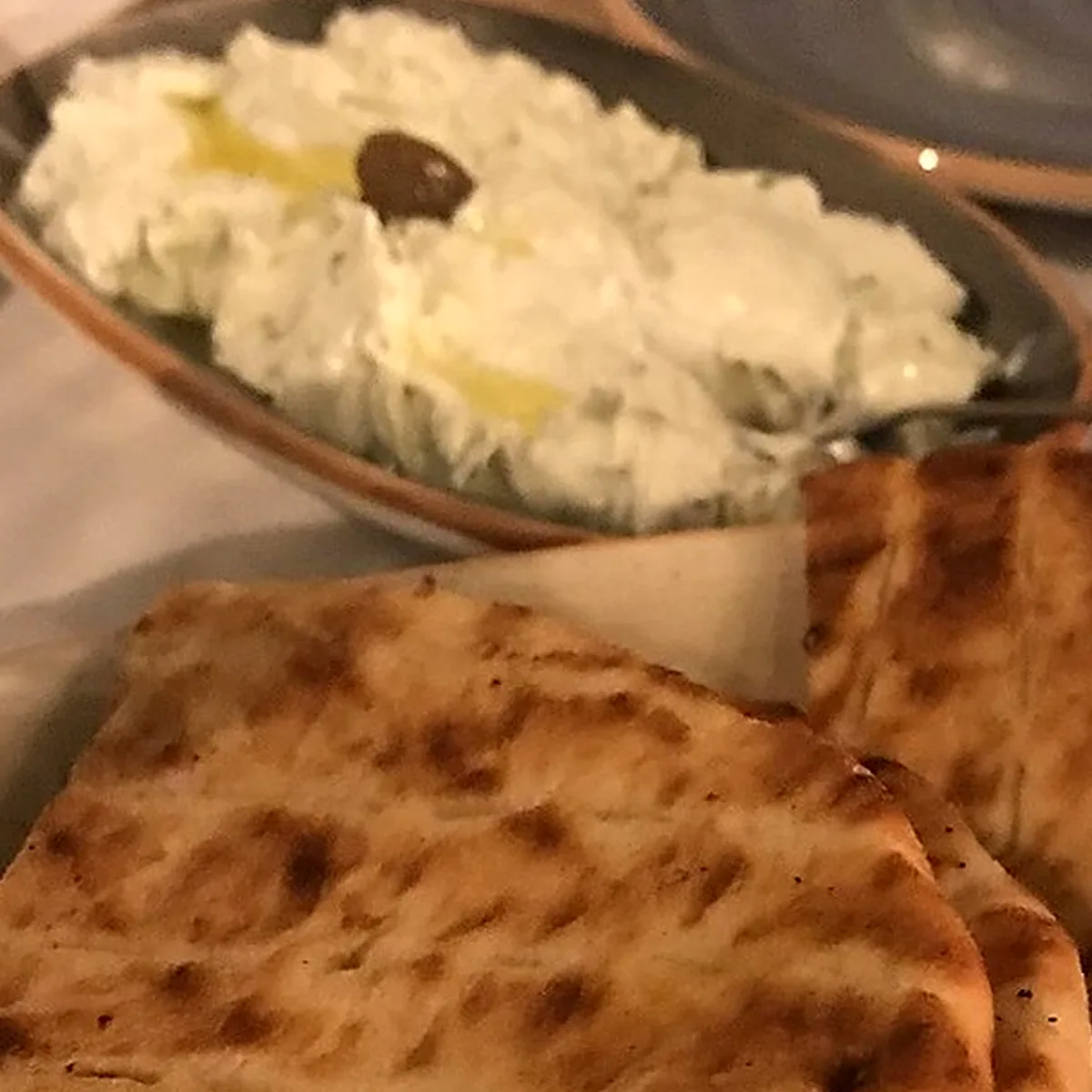 Step 2 for Tzatziki, showing the ingredients and preparation at this stage