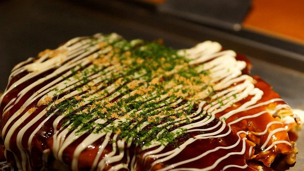 Okonomiyaki as served, showing the finished dish