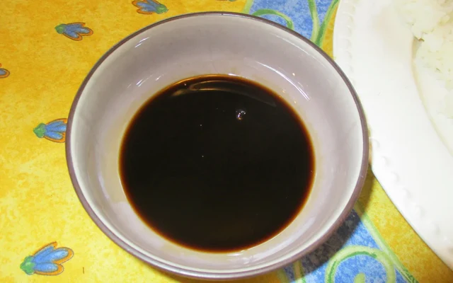 Dark soy sauce in a small ceramic bowl